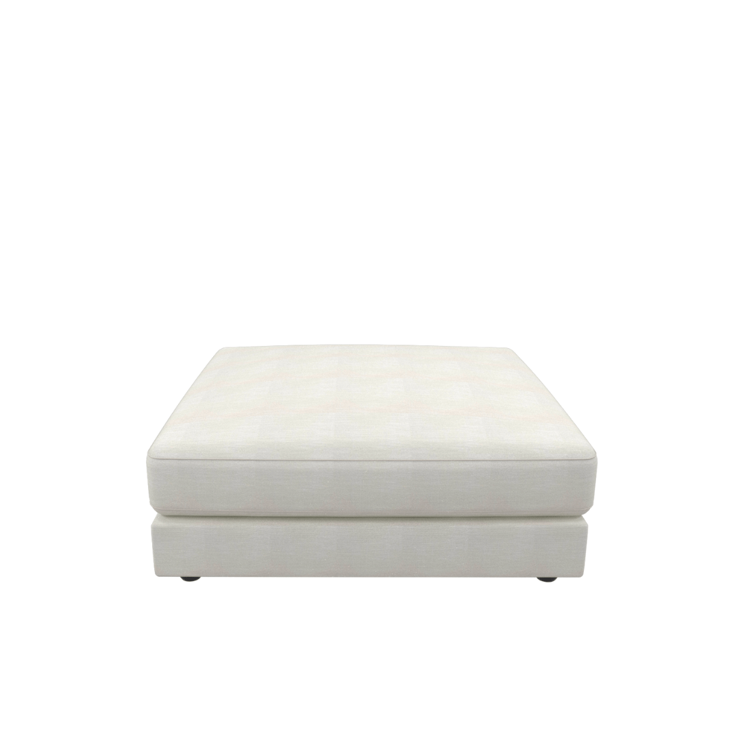 The Snowdrift Sectional Sofa Ottoman Unit is a square, light-colored upholstered ottoman with a flat top and minimalist design, ideal for pairing with modular sofas to achieve an elegant modern look. Shown on a plain white background.