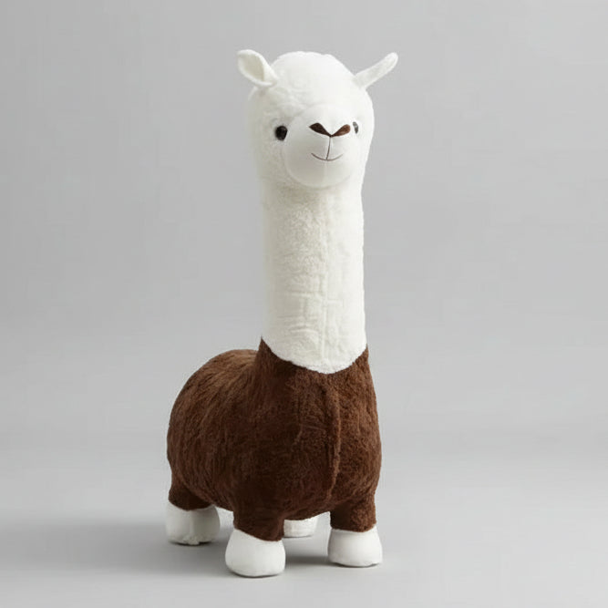A Playful Knit Llama Accent Chair, with a plush white face and brown body design, sits snugly on the carpeted floor near shelves filled with books and decor items.