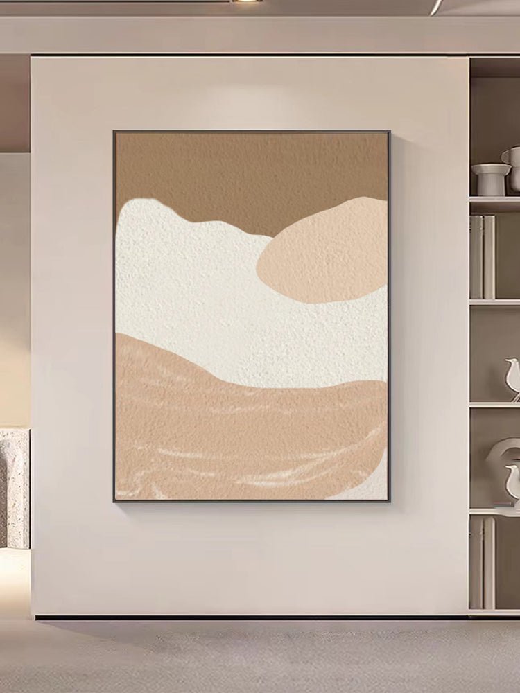 The "Blushing Horizon" Modern Abstract Wall Art, featuring beige and white organic shapes, adorns the wall. Nearby shelves with decorative objects complete the elegant setup, adding a contemporary flair to any space.