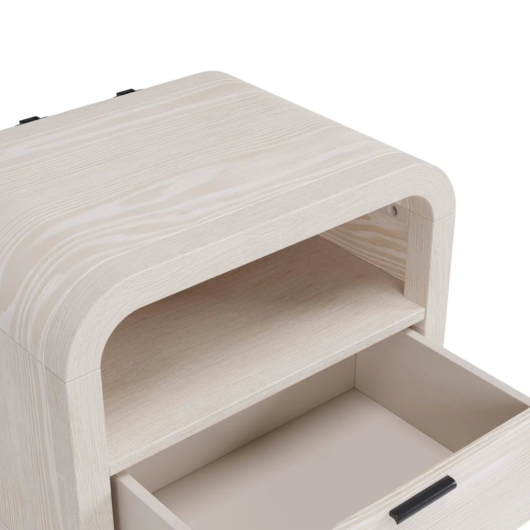 The Sugar White Nightstand features a wooden cabinet with an open drawer and shelf, light natural finish, rounded corners, and includes a USB charging station—ideal as a solid wood nightstand.