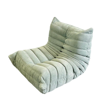 The Kids Chillax Lounger Sofa Chair, in light green corduroy with a plush tufted design and low profile, features padded sections for comfort. This contemporary modern style piece is perfect for adding a touch of elegance to any space.