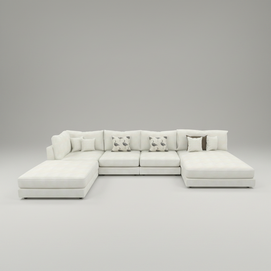 A modern sectional sofa in off-white upholstery with a chaise lounge on the left, several matching accent pillows, and two patterned throw pillows, shown on a plain white background.